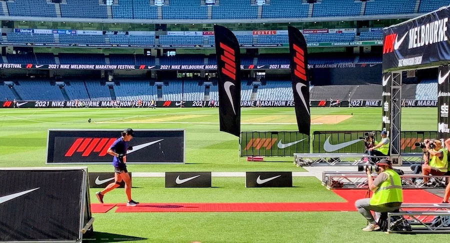 Tony crossing the finish line at the Melbourne Marathon