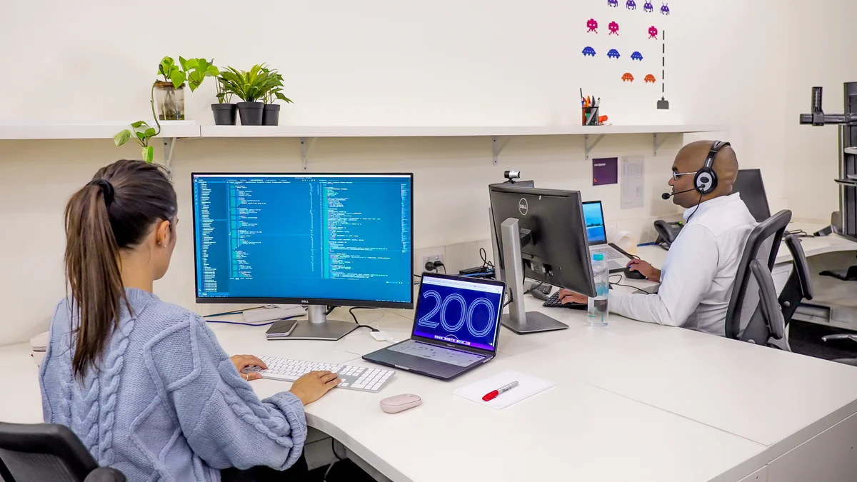 Martina and Emm working at Melbourne office
